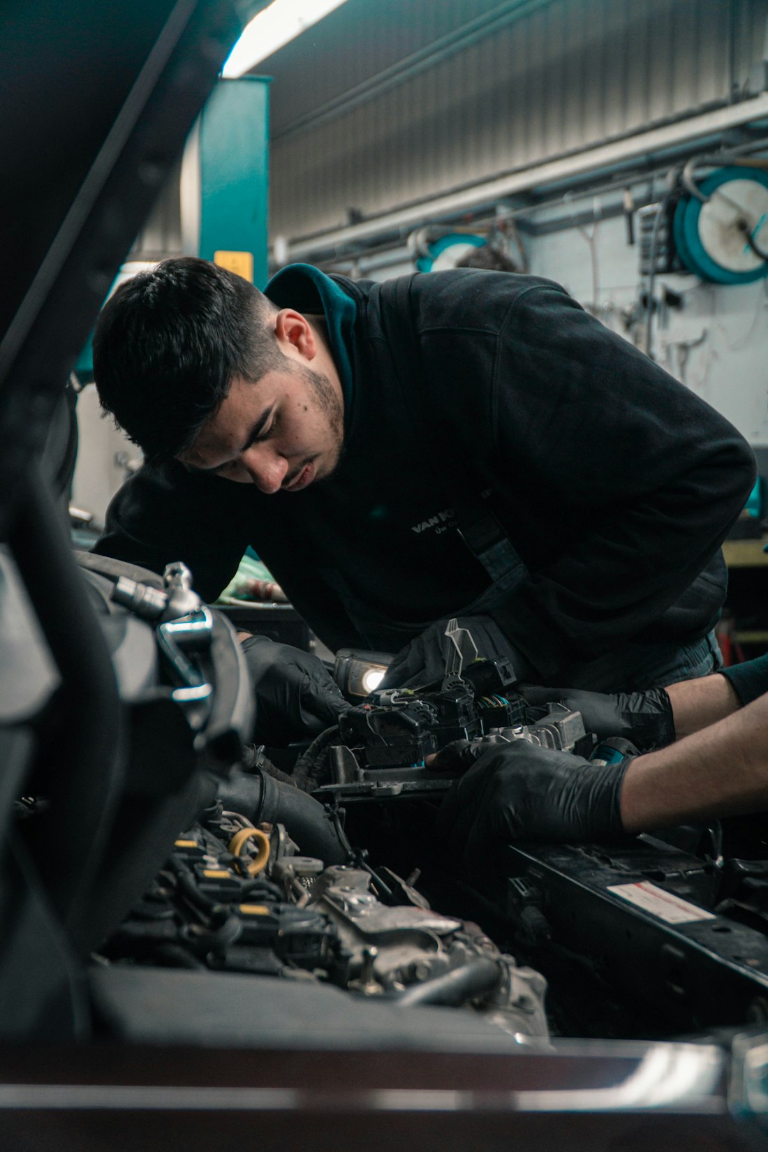 Technician working in an engine bay